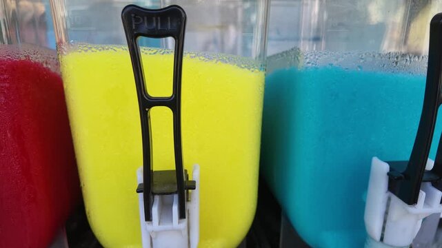 Bright liquids in yellow, blue, red