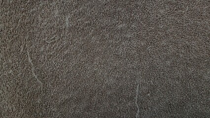 Close up of a dark brown towel fabric texture background. abstract structure. © kelilipan