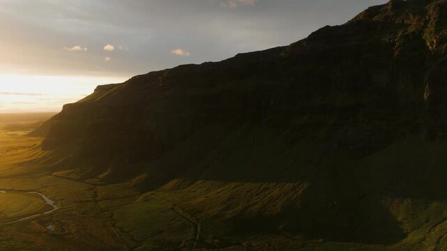 Aerial of Cliff Base and Stream at Dusk, Iceland