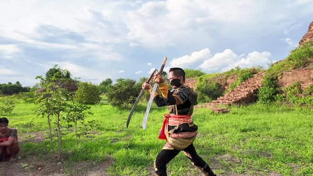 Thai Warrior Practicing Ancient Sword Fighting at Ayutthaya Historical Park