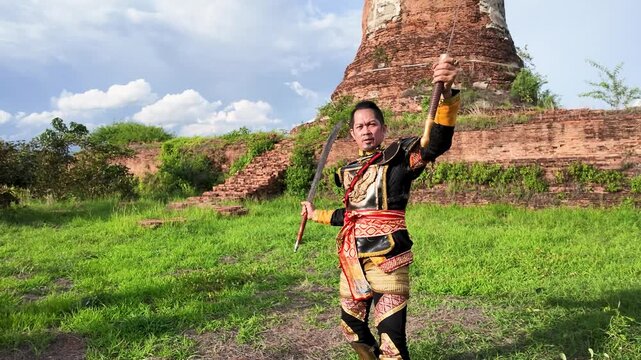 Thai Warrior Practicing Sword Skills at Ancient Ayutthaya Temple Ruins