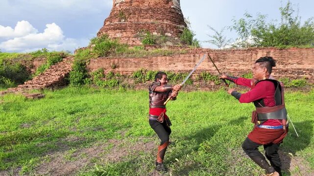 Thai Warriors Sword Fighting at Ancient Ayutthaya Ruins