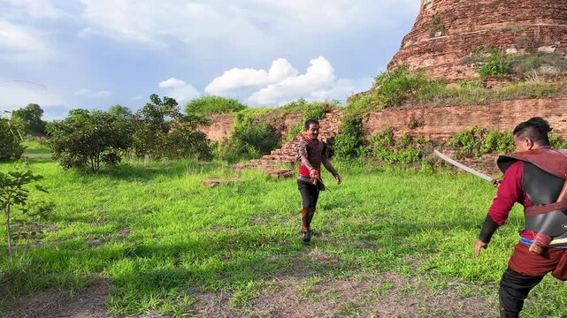 Thai Warriors Sparring with Swords at Ayutthaya Ancient Ruins