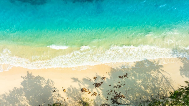 Nature of the ocean and blue sky Summer with sunshine, sandy beaches, clear blue waters sparkling against the blue sky. on an island with good ecology and environment Background for summer vacation