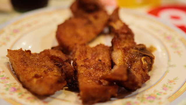 Crispy Fried Pork Cutlets Served on a Floral Patterned Plate