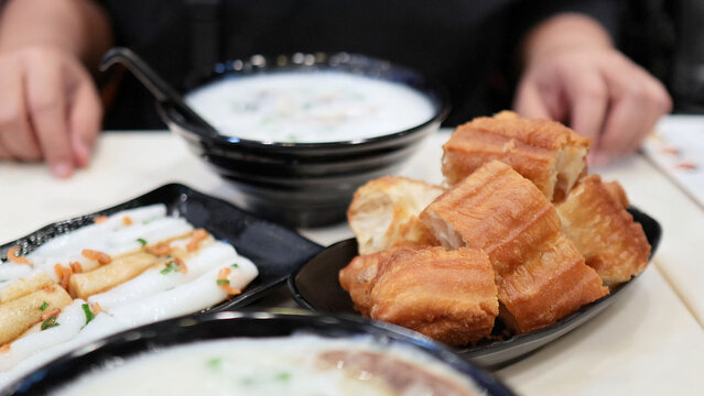 Traditional Hong Kong Breakfast with Congee and Fried Dough Sticks
