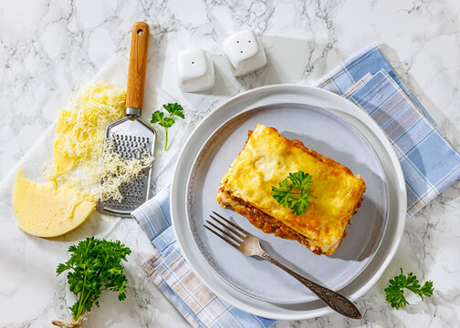 Baked lasagna square with beef, sauce, cheese