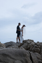 Obraz premium Bride Smiling Over Shoulder Wind Blown Veil Ko Samui