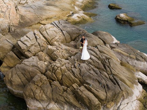 Aerial View of Rocky Coastline with Turquoise Water Ko Samui