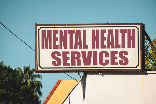 Aged and worn mental health services sign