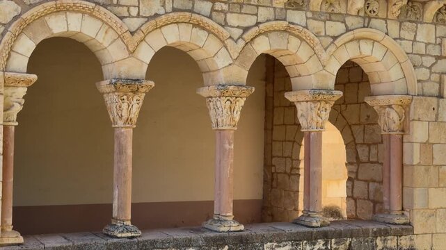 Ornate stone arches and columns of medieval architecture