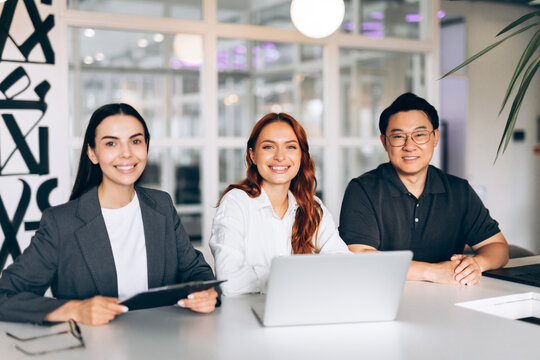 Diverse business team smiling at office meeting