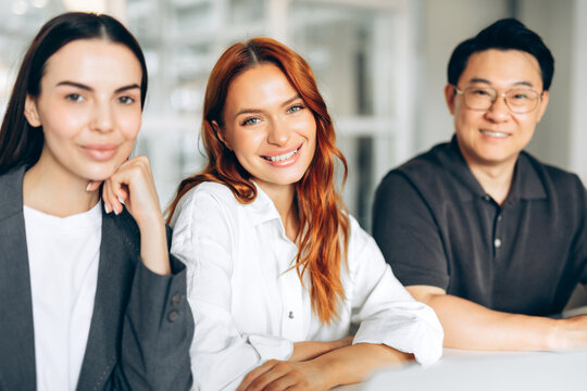 Diverse business team smiling at office meeting