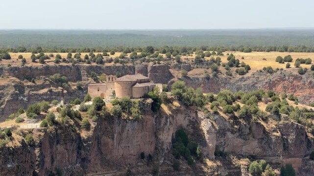 Hermitage of san frutos perched on a cliff in the duraton river canyon
