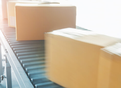 Package Boxes Moving on Conveyor Belt. Distribution Warehouse Shipping. Logistics Warehouse. Package Boxes Supplies. Supply Chain Shipment Goods. Distribution Warehouse.