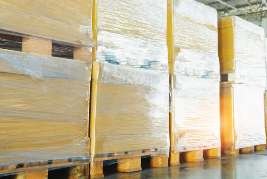 Bulk of Package Boxes on Wooden Pallets. CardBoard Boxes. Distribution Warehouse Shipping. Logistics Warehouse. Package Boxes Supplies. Supply Chain Shipment Goods. Distribution Warehouse.	
