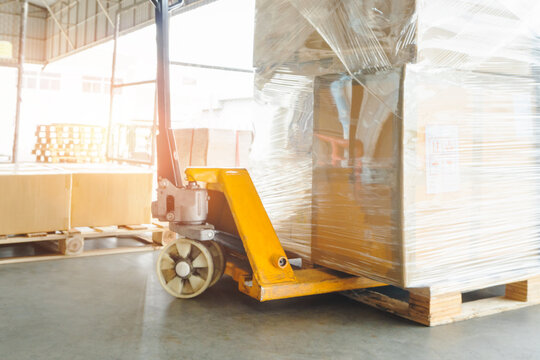 Bulk of Package Boxes on Pallets in Warehouse. CardBoard Boxes. Forklift Pallet Truck. Distribution Warehouse Shipping. Logistics Warehouse. Package Boxes Supplies. Supply Chain Shipment Goods. 