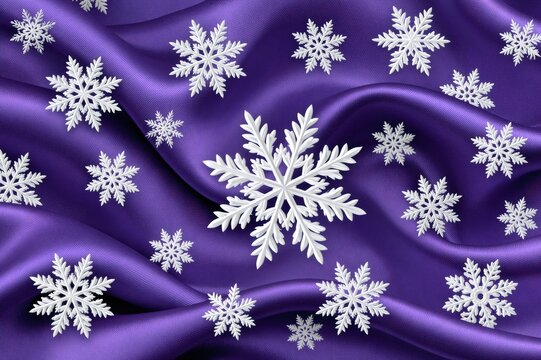 White snowflakes falling on purple satin fabric