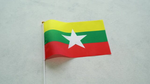 Myanmar flag close up on isolated background. Concept Burmese country flag.