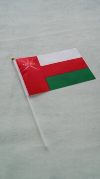 Oman flag vertical close up shot. Concept Omani country flag.