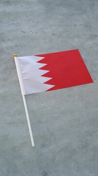 Bahrain flag vertical close up shot. Concept Bahraini country flag.