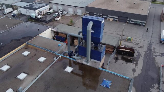 Industrial Dust Collection system on a industrial building pull out, aerial, drone 4K