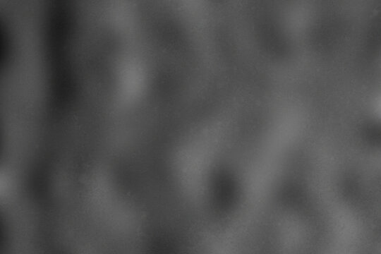 Abstract dark gray texture, blurry charcoal smoke background, soft monochrome gradient surface for cinematic overlays
