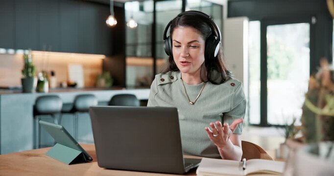 Woman, wave and video call in home with laptop, headphones or remote work with online class teacher. Happy, person and freelance educator in house with computer, hello or meeting for virtual school.