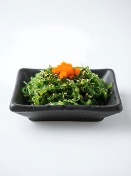 Seaweed salad with tobiko isolated on white background