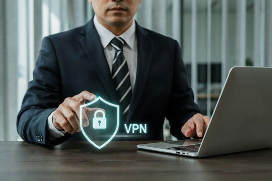 Business executive using a laptop with a digital vpn shield icon for secure network access
