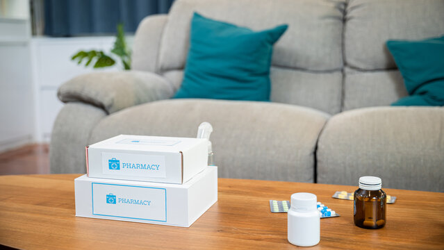 Online purchase delivery of medicines to your home from drugstore, Home medicine with medicine package box free first aid kit with pills from pharmacy hospital delivery service