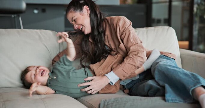 Love, mother and tickle toddler in home, laugh and bonding together for development on weekend. Parent, child and play funny game on sofa with happiness, connection and cute boy with family care