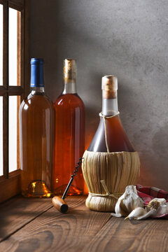 Wine Bottles and Garlic Still life with window light.