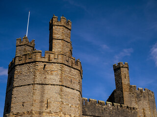 Eagle Tower of Caernarfon Castle against a deep blue sky, Wales, UK. © Cavan