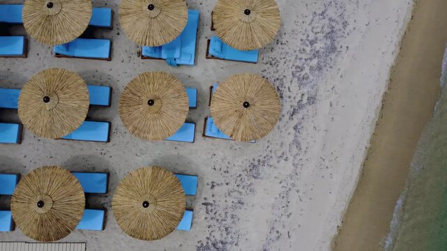 Turquoise Mediterranean Shoreline with Organized Beach Loungers in Kassandra Greece, Birds Eye View