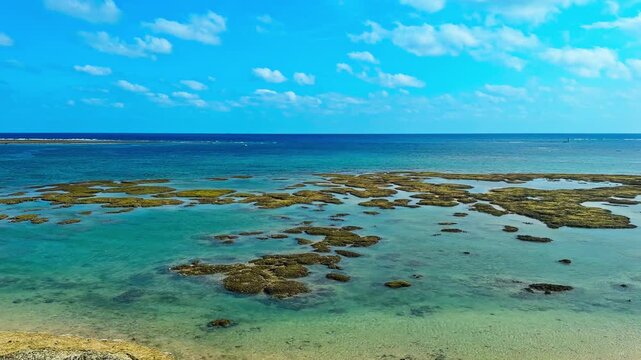 Iconic Window-side Cafe Of Hamabe no Chaya Overlooking Shallow Coral Reef Formations Near Mibaru Beach In Nanjo, Okinawa, Japan. Panning Shot
