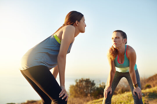Outdoor, fitness and girl friends on break for exercise, active or wellness on weekend morning. Challenge, athletes and people with relax in nature for sports cardio, workout or health at trail.