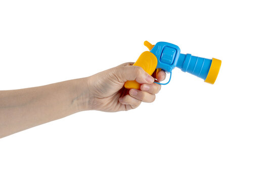 Blue plastic toy gun in hand on transparent background