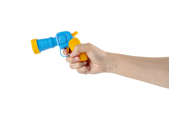 Blue plastic toy gun in hand on transparent background