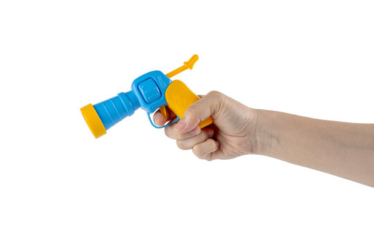 Blue plastic toy gun in hand on transparent background