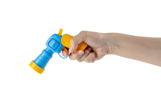 Blue plastic toy gun in hand on transparent background