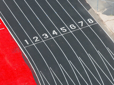 Close-up of numbered running track lanes