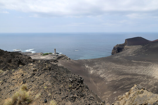 View of the Farol da Ponta dos Capelinhos lighthouse on the Azores island of Faial, Azores, Portugal    