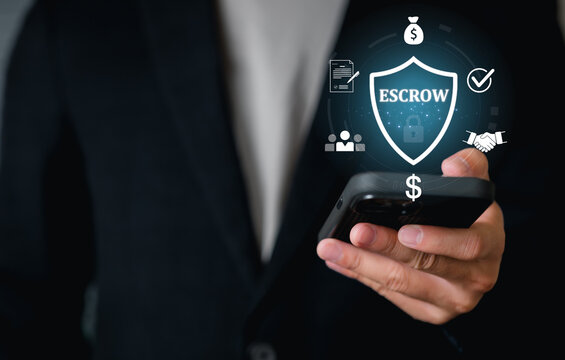 A person in business attire holds a smartphone with Escrow. This refers to money, deposits, or assets deposited with a third party as collateral, security services, and financial transactions.