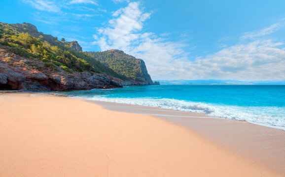 Beach of Cleopatra with sea and rocks of Alanya peninsula - Antalya, Turkey 