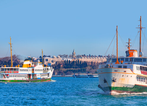 Famous historical peninsula with trail foaming behind a passenger ferry boat - Bosphorus, Istanbul