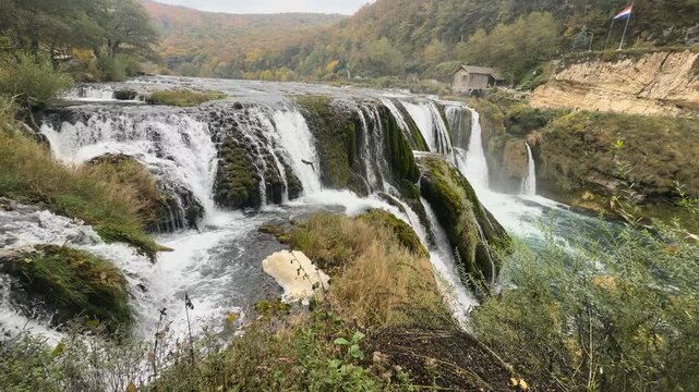 Handheld scenic shot of Strbacki buk waterfall on the Una river border landscape