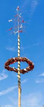 Traditional Bavarian Maypole in a Village &ndash; German Tradition and Cultural Heritage Concept Vertical