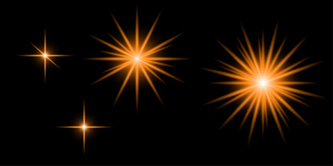 Fototapeta premium Set of glowing orange star bursts and sparkling light effects isolated on a solid black background