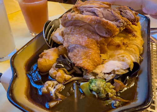 Freshly roasted Peking duck with Peking sauce at the Chinese restaurant.
